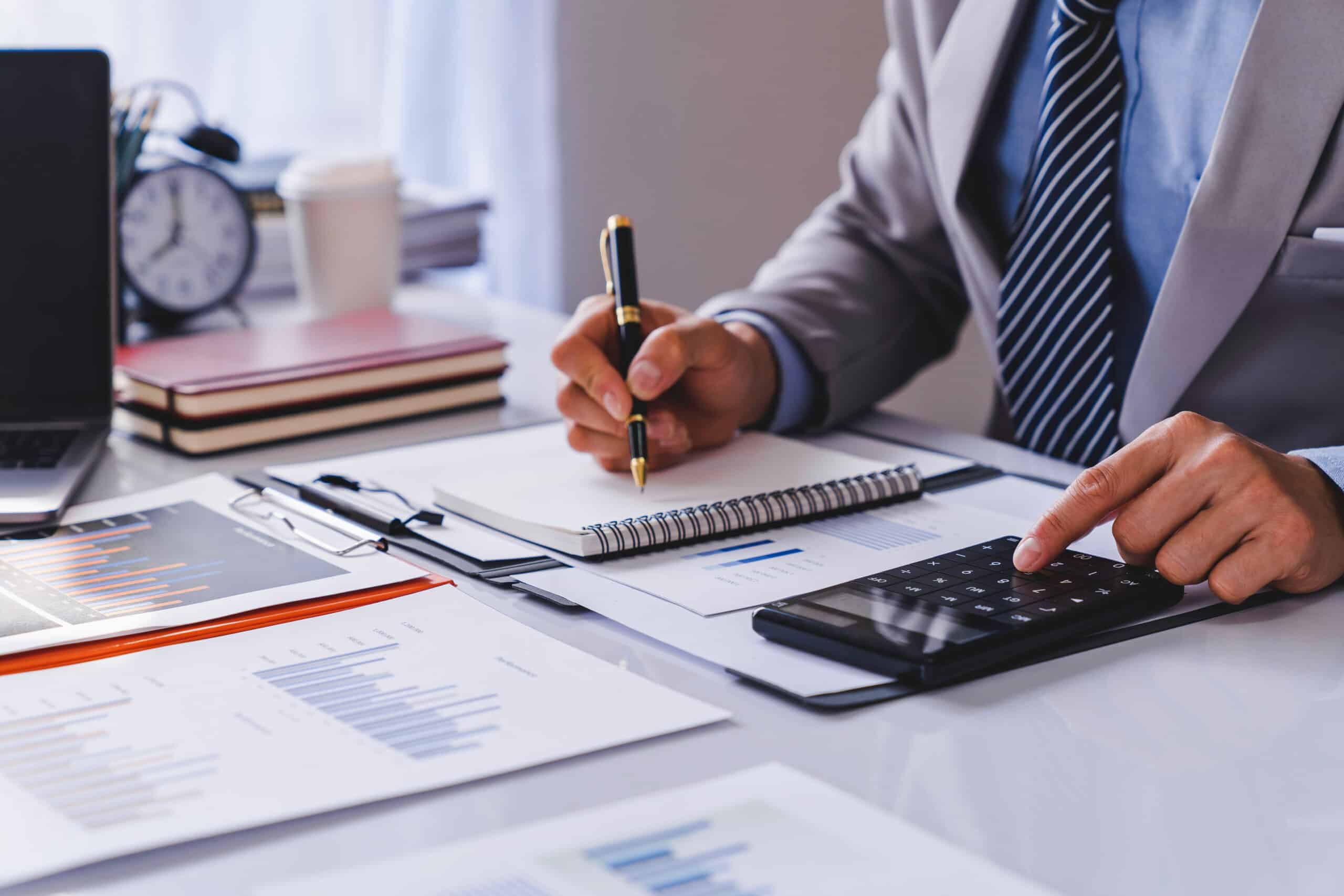 Business Financing, businessman doing finances and calculating a